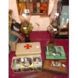 Two glass oil lamps, three decorative tins, a wooden cigarette box, etc.