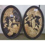 A pair of Bretby Japanese style pottery wall plaques