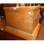 A 20" antique waxed pine lift-top box with flanking iron drop handles