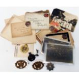 Military letter from a First World War soldier, six cap badges and postcards
