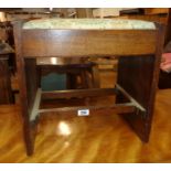 A 1930`s oak piano stool with drop-in seat