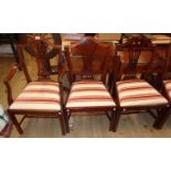 A set of twelve reproduction mahogany framed dining chairs in the antique style with pierced splat