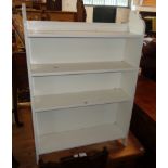 A 25" early 20th Century painted wood free-standing four shelf open bookcase