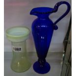 A vaseline glass hyacinth vase and a Bristol blue jug