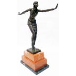 An Art Deco style bronzed figure of a female dancer on a plinth base