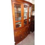 A 4' 10" Mark Webber Furniture "Townsend" range mahogany effect break bow front display cabinet with