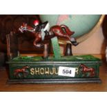 A modern painted cast iron showjumper pattern money box