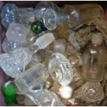 A box containing a quantity of stoppers and miscellaneous glass