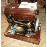 A late Victorian Singer sewing machine with original receipt