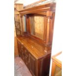 A 5' early 20th Century mahogany mirror back sideboard with bevelled plate and flanking turned