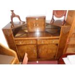 A 4' 6" vintage walnut veneered sideboard/drinks cabinet with central fitted cupboard and canted