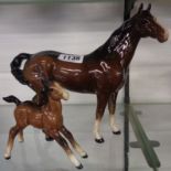 A Beswick brown mare and foal