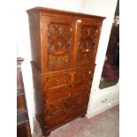 A 32" 20th Century polished oak cabinet on chest in the Jacobean style with pair of dummy drawer