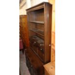 A 3' 2 1/2" Ercol dark stained elm dresser with three plate shelves and fall-front compartment to