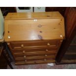 A 36" modern polished pine bureau with fitted interior and four long graduated drawers under, set on