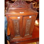 A 14" late Victorian walnut cabinet with decorative gallery to top and shelves and two drawers