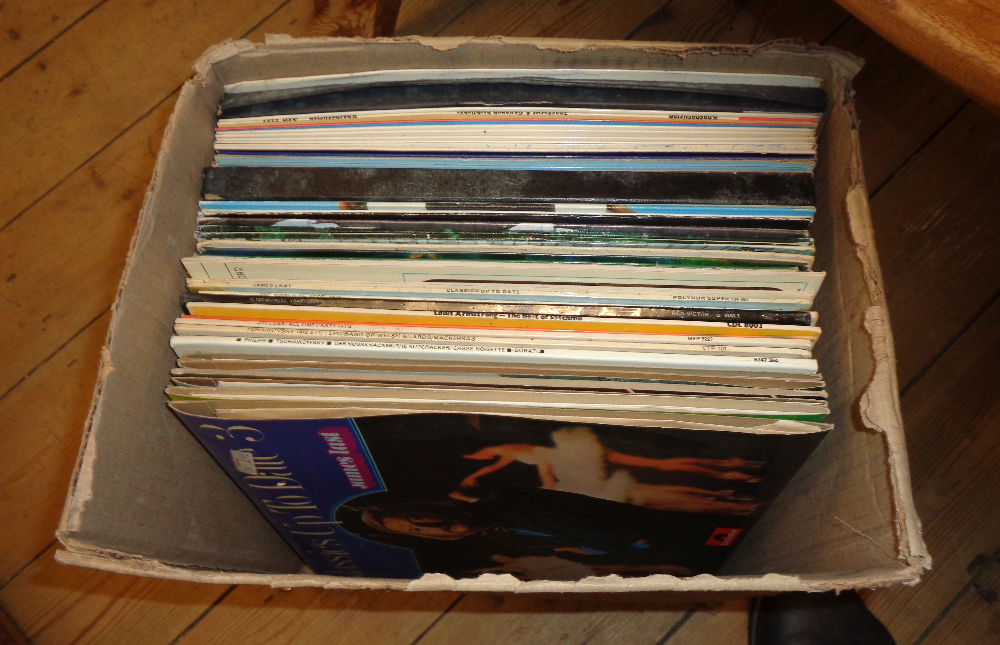 A box of LP records including James Last, Harry Lauder, etc.