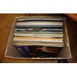 A box of LP records including James Last, Harry Lauder, etc.