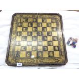 A late 19th Century Chinese lacquered papier-mâché chess, checker and backgammon board with gilt