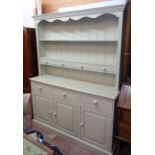 A 5' modern painted pine two part dresser, the two shelf open plate rack with four short drawers