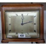 A 1930`s polished oak cased mantel timepiece with silvered oblong dial and Elliott eight day