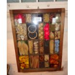 A framed kitchen spice display