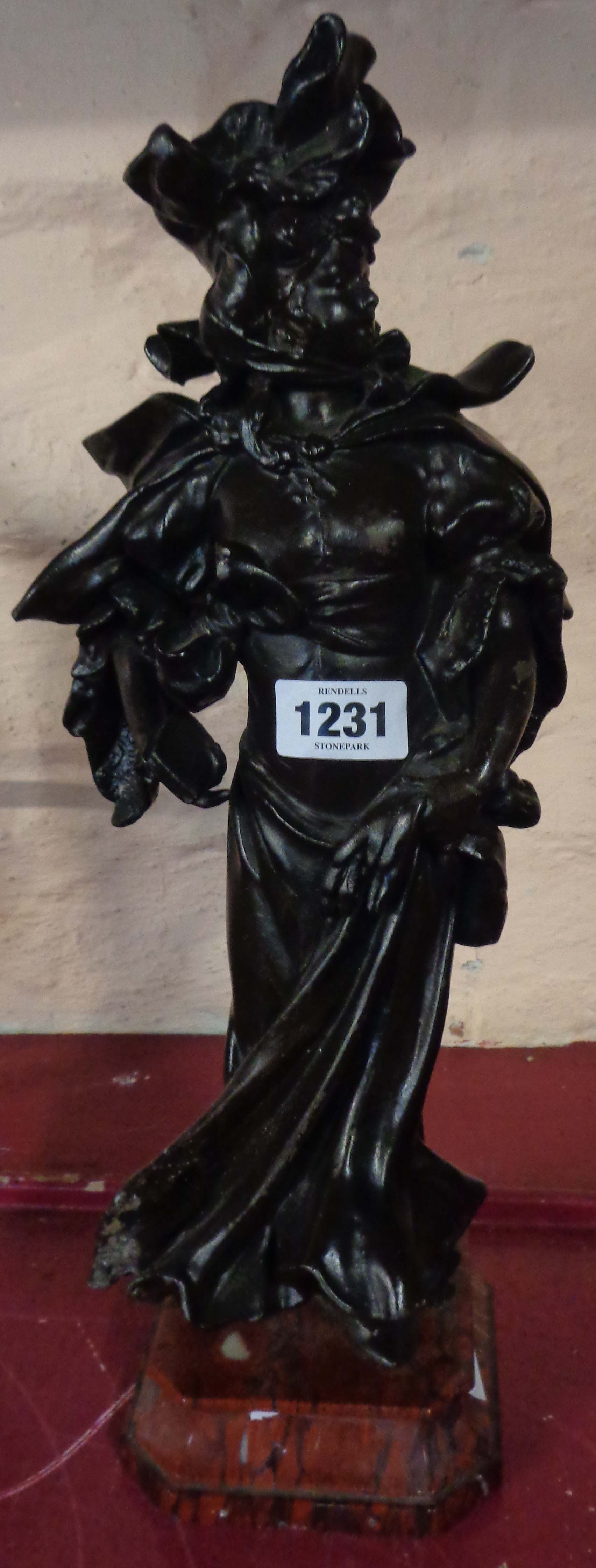 A bronzed spelter figure of a Victorian lady