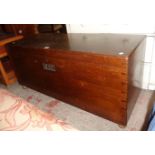 A 4' early 20th Century polished oak storage trunk, set on Shepherd castors