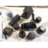 A collection of camera lenses including Vivitar 28-210mm, Minolta 35-70mm AF Zoom, Schneider