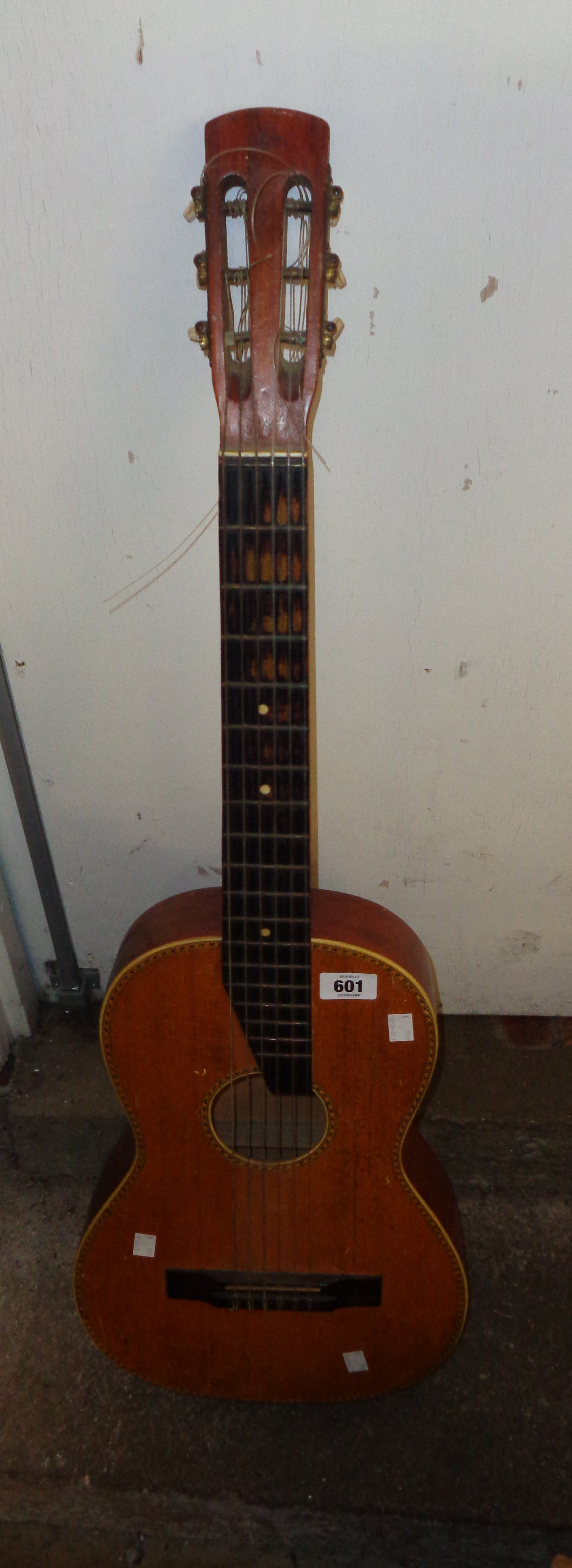 A small Arcus Elite acoustic guitar