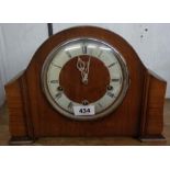 A mid 20th Century walnut cased mantel clock with Smiths Enfield eight day chiming movement