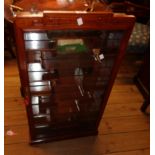 An 18" modern Chinese hardwood wall mounted display cabinet with mirror backing and shaped