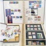 Two albums containing FDC's and mint stamps - sold with a small box containing loose stamps on