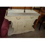 A 3' 6" French style marble topped washstand with remains of flanking towel rails, cream painted