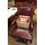 An Edwardian stained walnut framed drawing room armchair with studded oxblood leather upholstery,