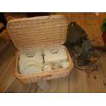 A green canvas satchel containing a vintage Handy Breeze electric table fan - sold with a wicker