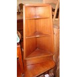 A 19" retro teak and mixed wood freestanding three shelf corner unit of tapered design