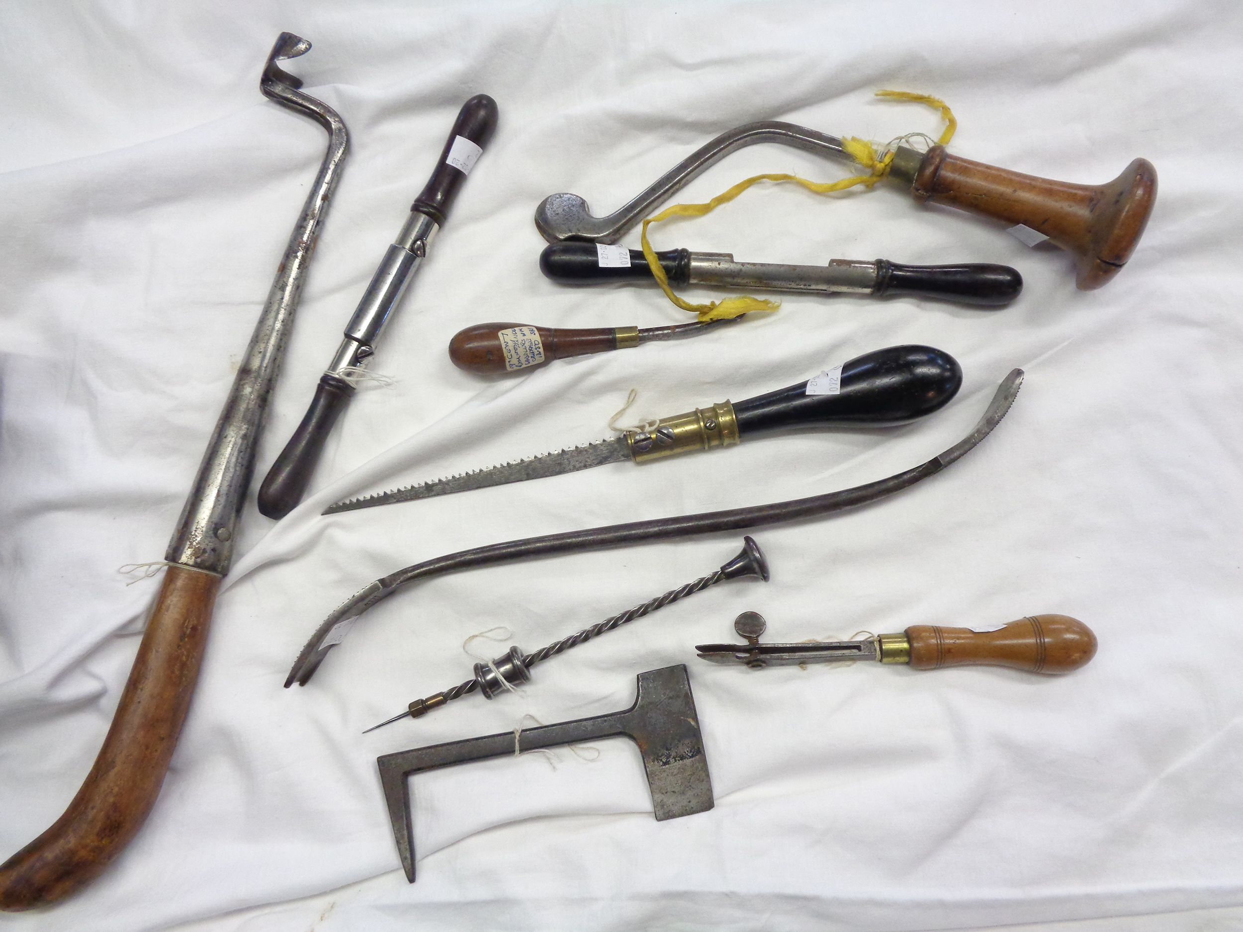 A box of tools including circular spoke shaves, Archimedes drill, sabotiers drill, saddler's