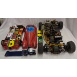A box containing a quantity of toy cars, remote control car chassis for restoration, etc.
