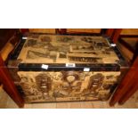 A 19 1/2" vintage travelling trunk with decoupage newspaper clipping decoration