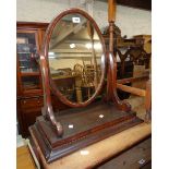 A 21 1/2" Victorian mahogany framed platform dressing table mirror with oval plate, scroll