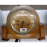 A vintage polished oak cased mantel clock, eight day gong striking movement