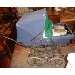 An 1981 Silver Cross pram including cat net, brochure, bedding and other accessories