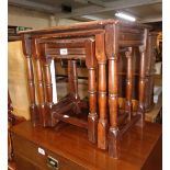 A nest of three 20th Century stained oak tea tables