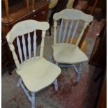 A set of four late 20th Century painted wood Windsor style kitchen chairs with decorative top