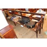 An 11" Victorian stained wood platform or waiting room bench with simple rail back, solid seat and