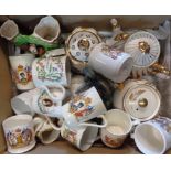 A quantity of assorted ceramics including commemorative mugs, decorative teapots, etc.