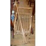 A vintage child's toy wooden cart