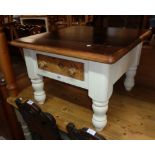 A 26 1/2" modern part painted pine tea table with stained top and natural drawer front, set on heavy