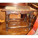 A 23" stained oak joint stool style tea table, set on splayed turned supports